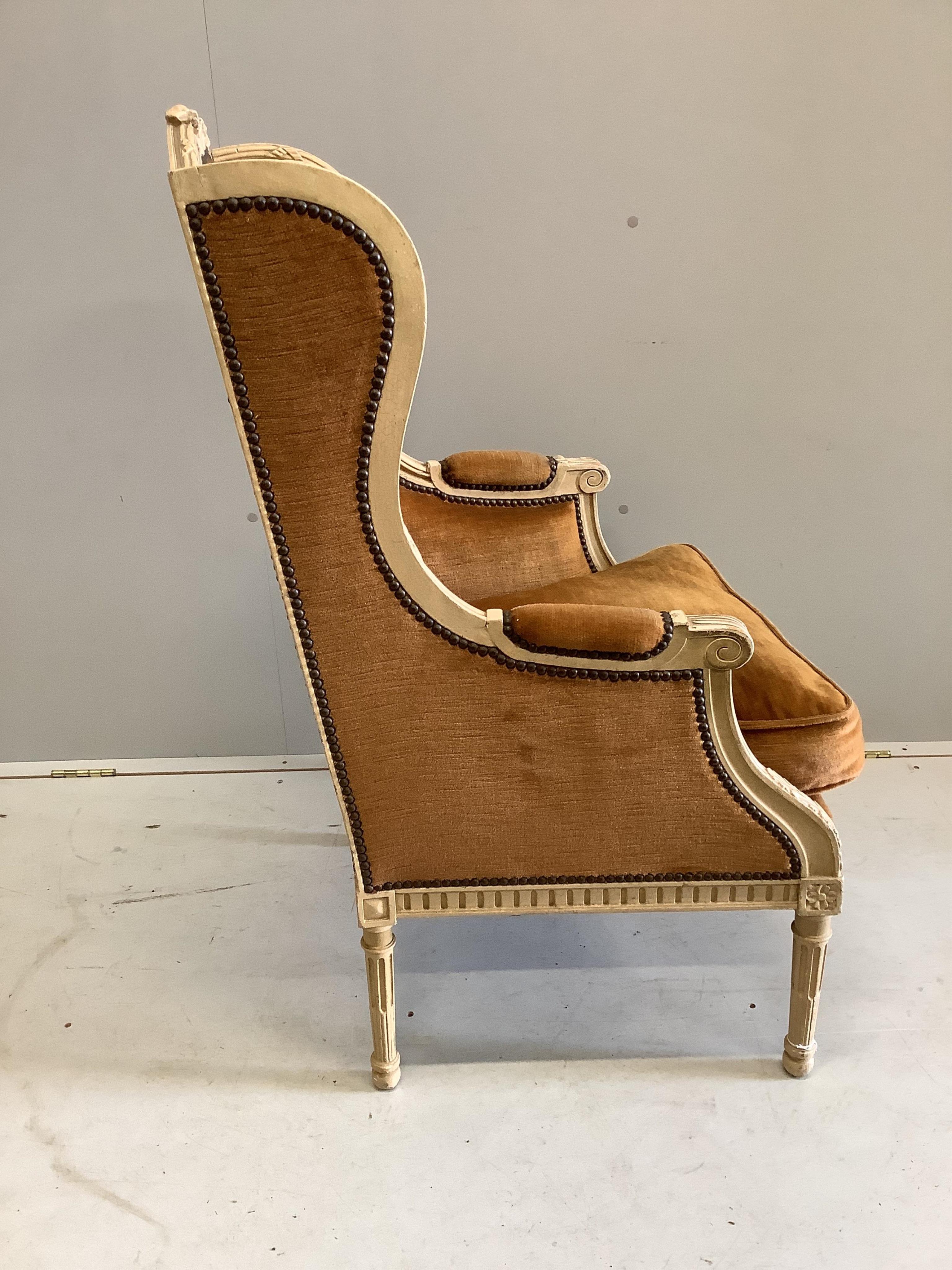 A Louis XVI style cream painted fauteuil, width 64cm, height 74cm. Condition - fair